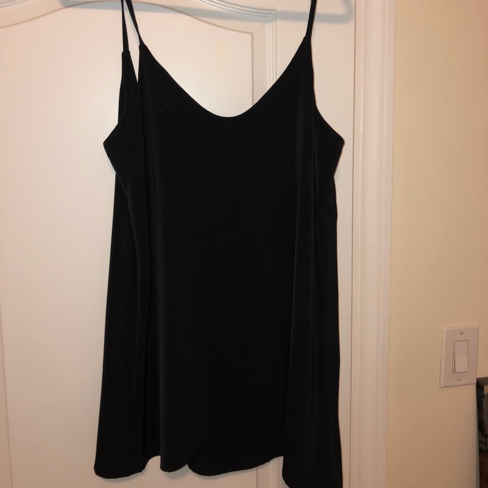 Loose fitting, open back black dress.